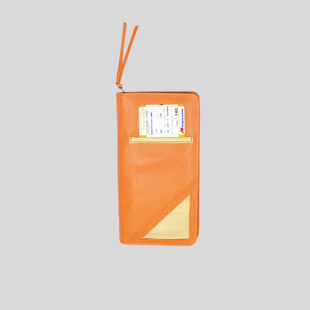 The back of an orange leather wlallet shows a pocket where a boarding pass is stored.
