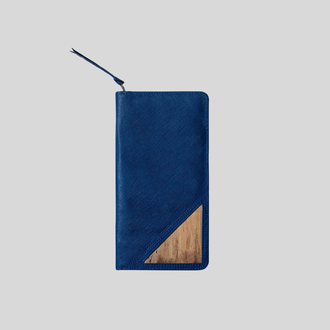 A royal blue vegan leather wallet with a wristlet.