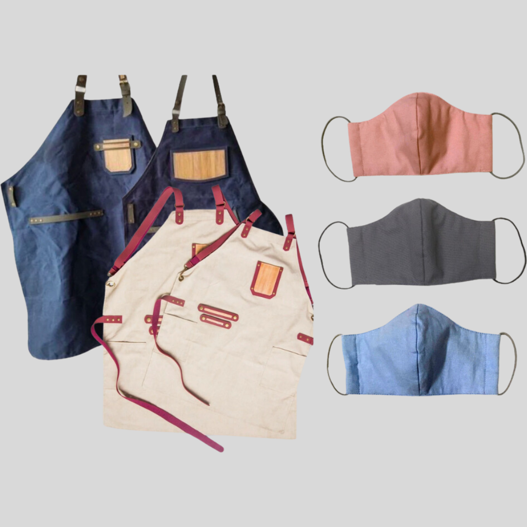 2 matching dark blue cloth aprons with vegan leather pockets, 2 pink and cream matching aprons with the same vegan leather style, and 3 cloth masks in pink, gray, and blue.