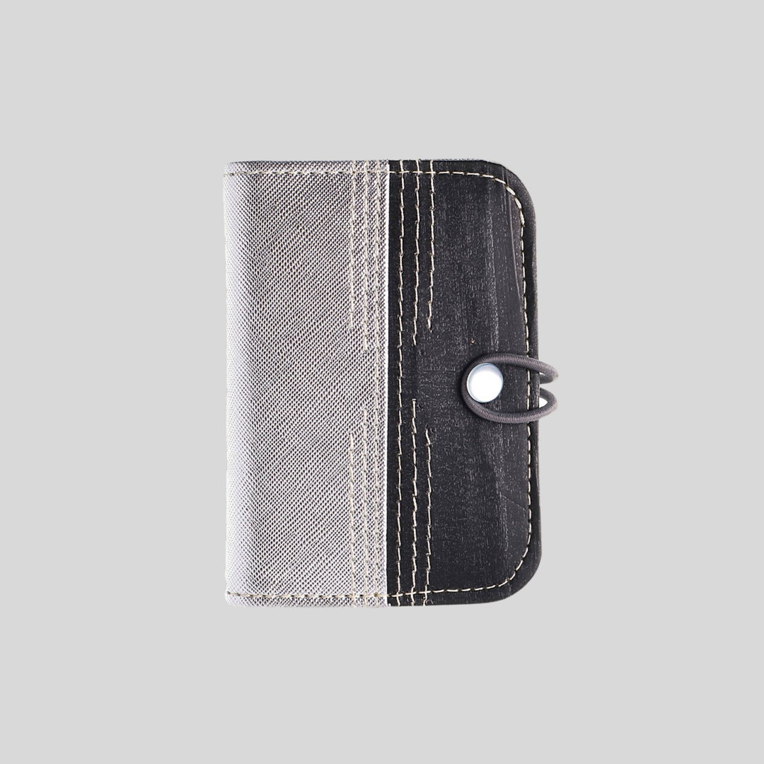 A two-toned light gray and dark gray card wallet.