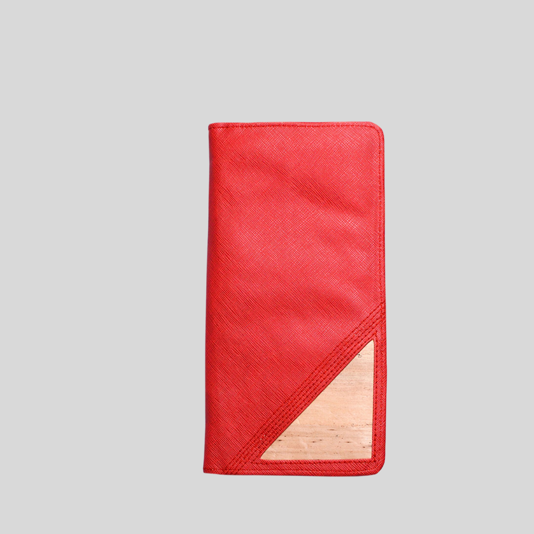 A ruby red vegan leather wallet with a pale brown corner for accent.