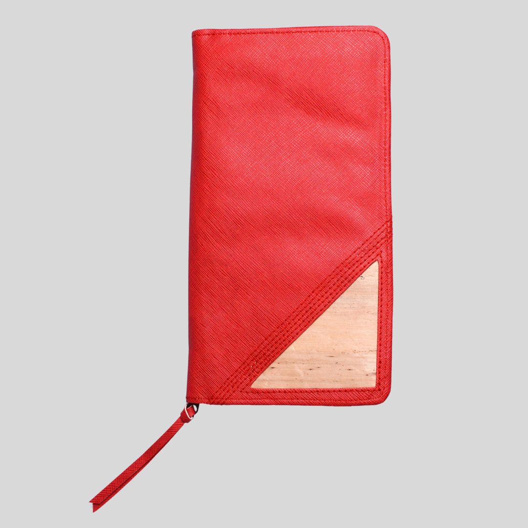 A bright red vegan leather has a tassel on its zipper.