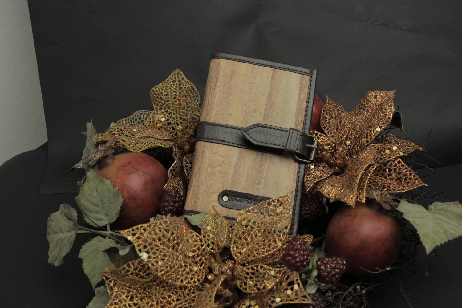 A brown vegan leather journal on top of decorations