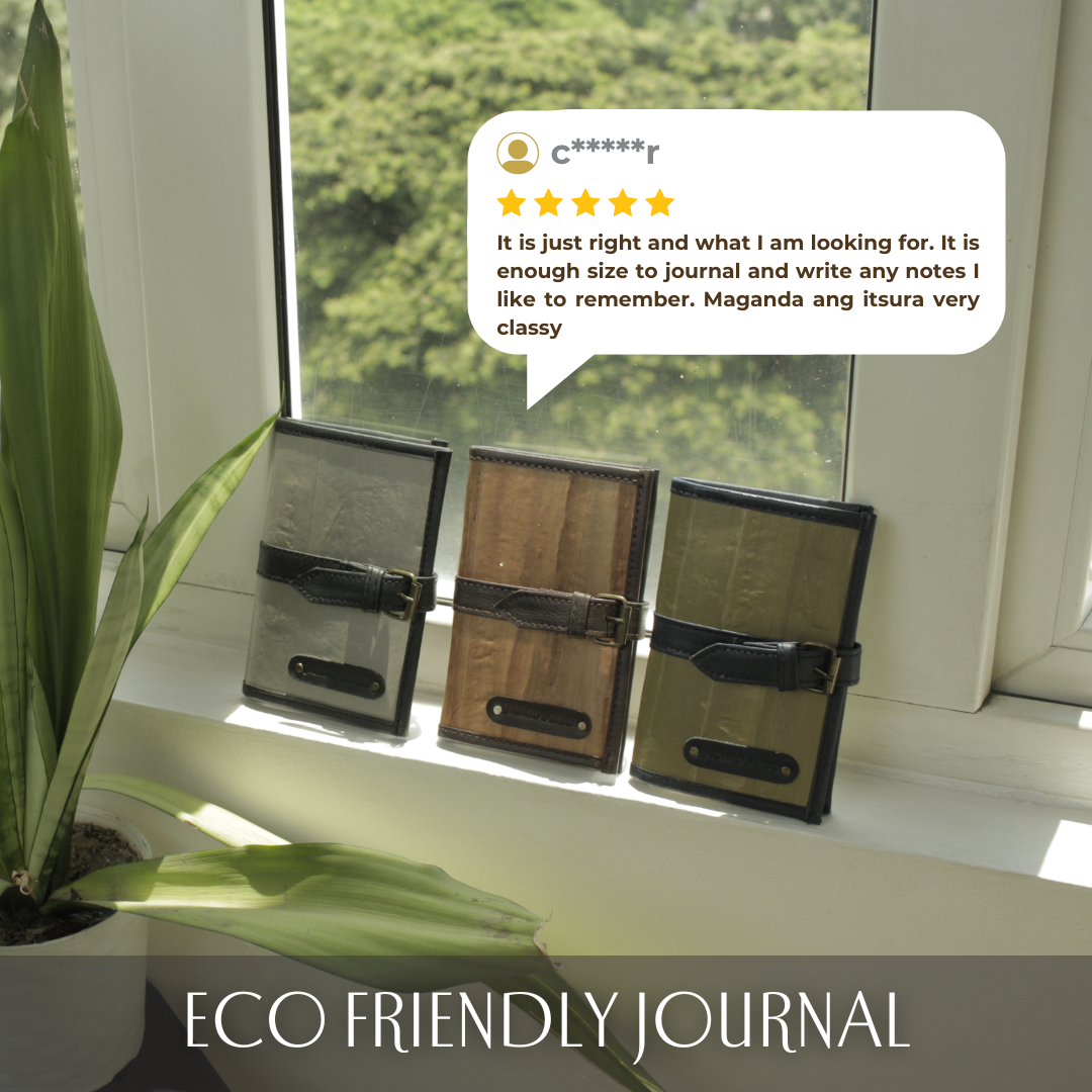 Three vegan leather journals resting on a windowsill.