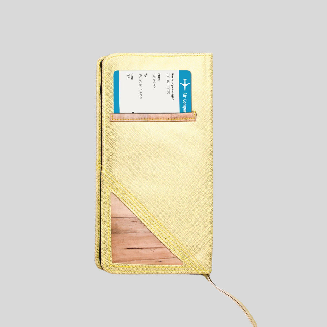 A lemon yellow vegan leather wallet stores a plane ticket in its back pocket.