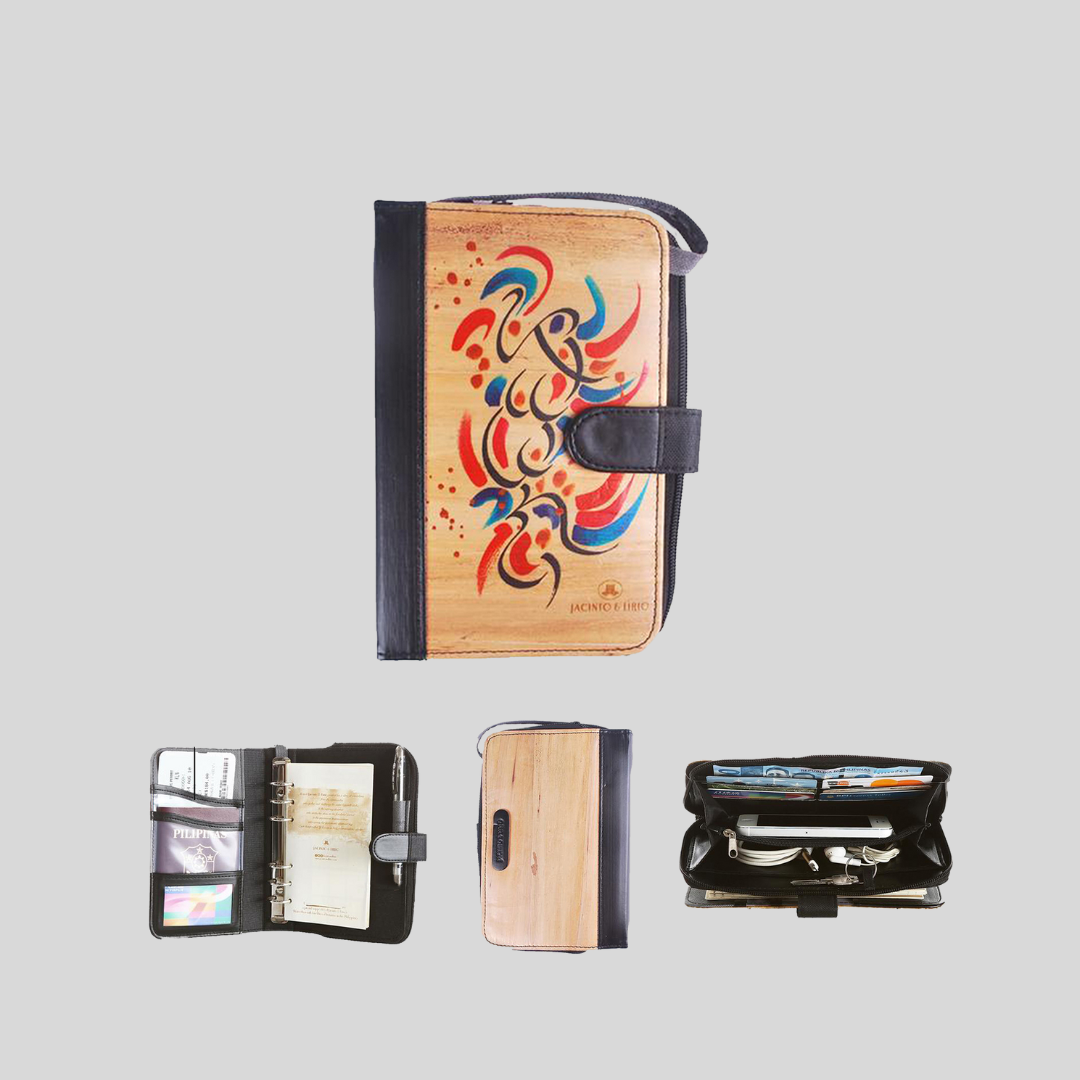 A vegan leather notebook with a black leather spine and magnetic snap closure also has a metal spine for refillable pages, and multiple built-in compartments within the journal. It even has a built-in wallet that can store a phone.