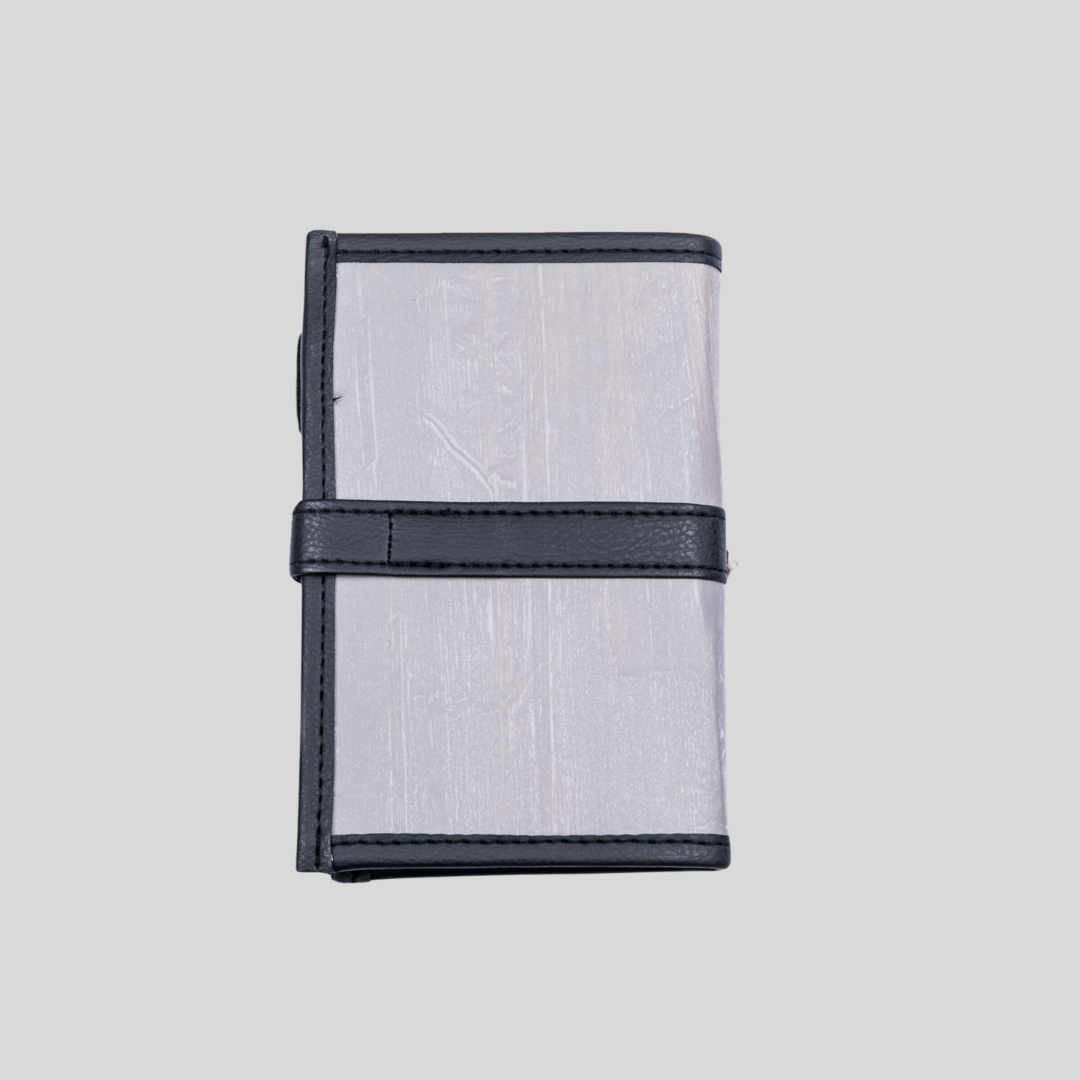 The back of a two-toned gray leather notebook.