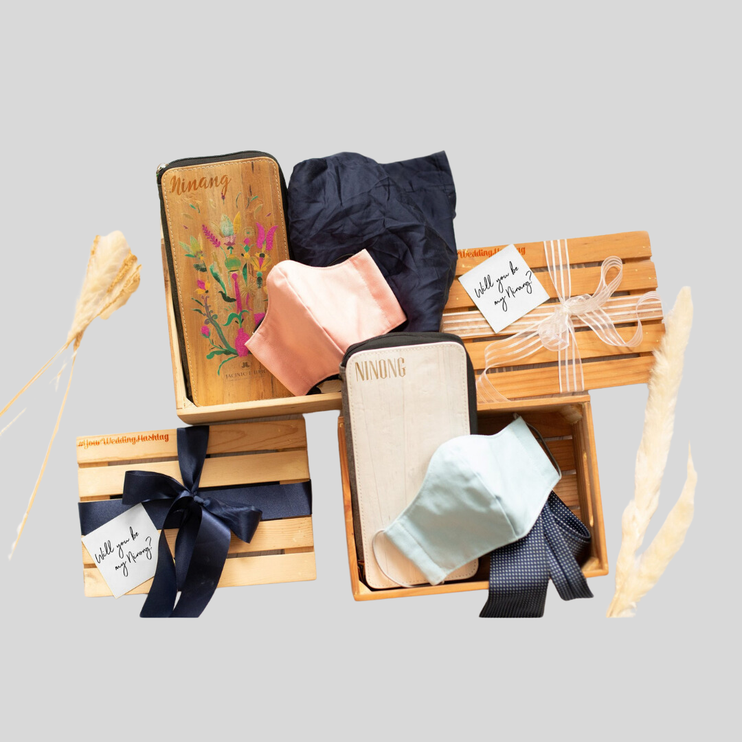 4 variations of a gift set of vegan leather products: one rectangular zipped wallet/purse and one fabric cloth mask. The wallet/purse can come in a plain pastel color or have a colorful design on it, both with customized laser name engraving.