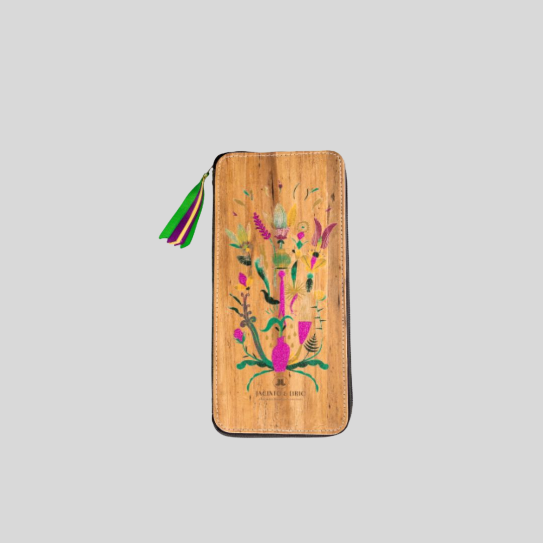A vegan leather rectangular wallet and passport holder with a vibrant color design on it.