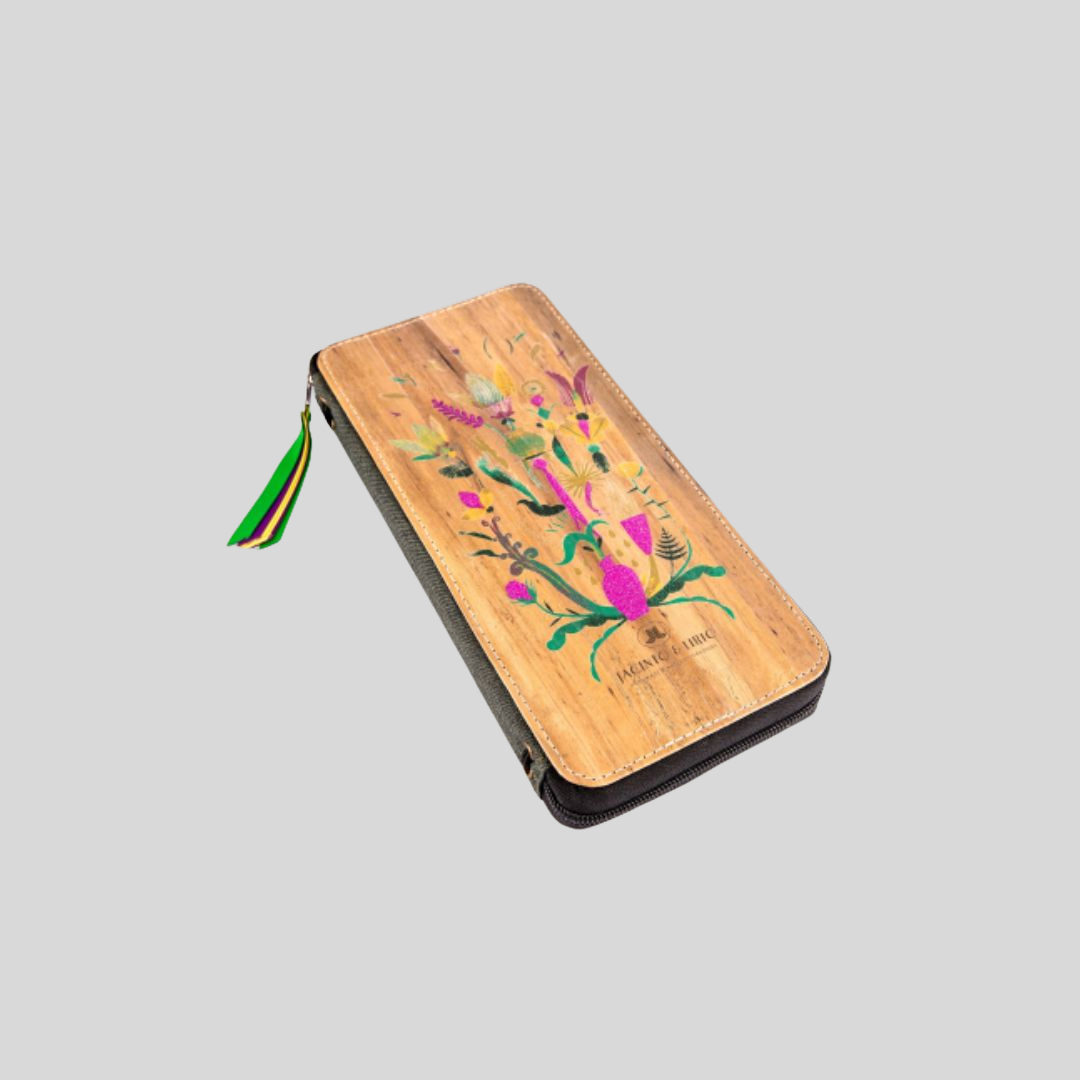 A vegan leather rectangular wallet and passport holder with a vibrant color design on it.