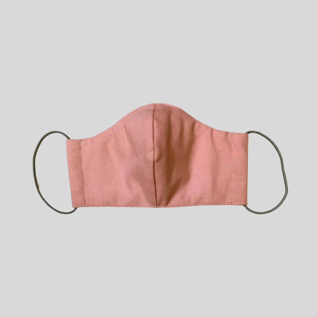 A pastel pink cloth mask