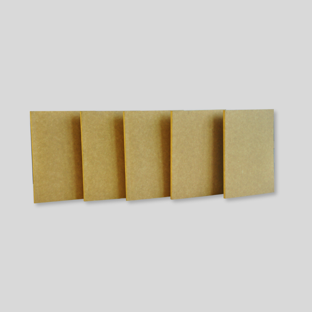 5 pieces of blank notebook refills with a paperboard exterior, displayed upright next to each other.