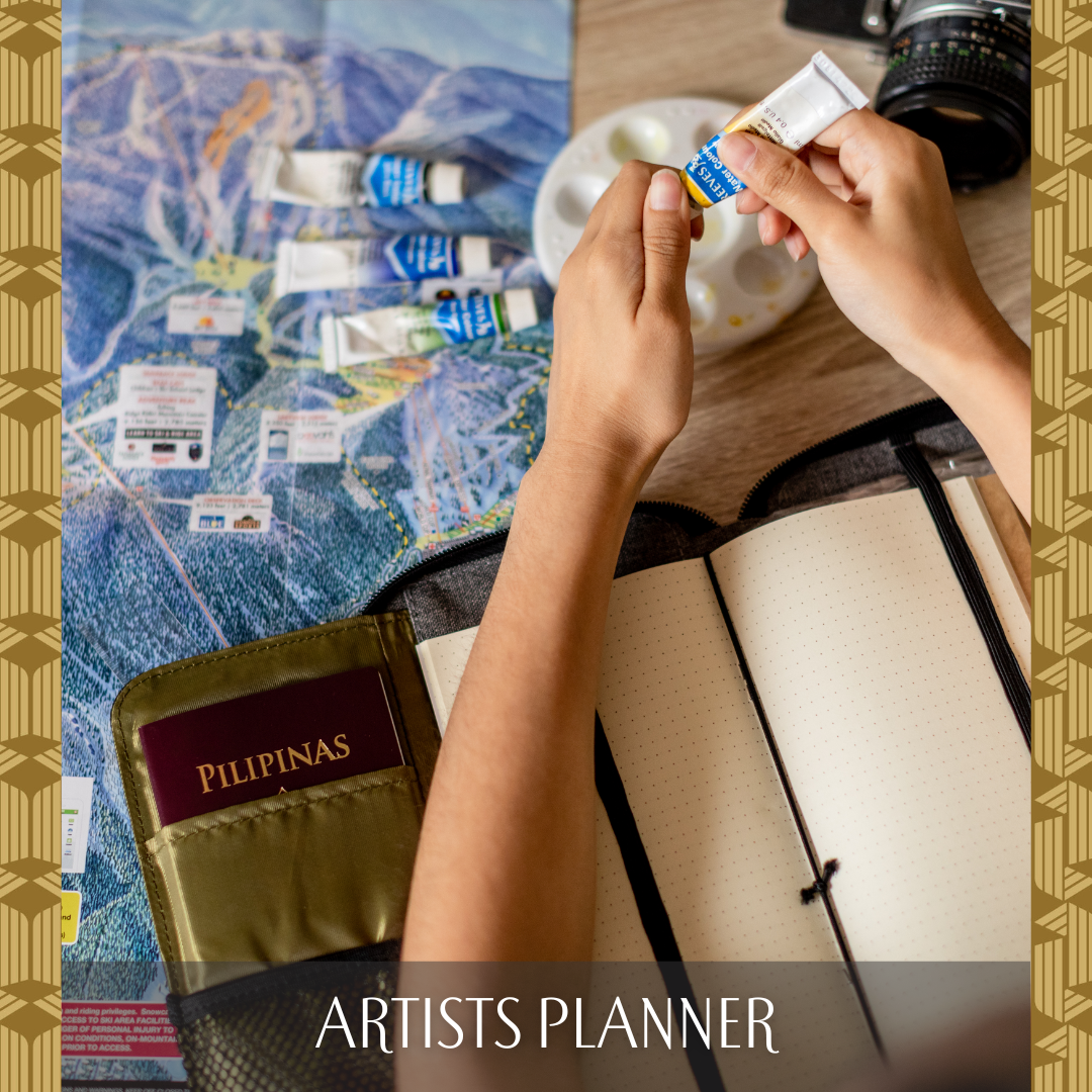 A woman painting a journal that is stored in the inside of a wallet.