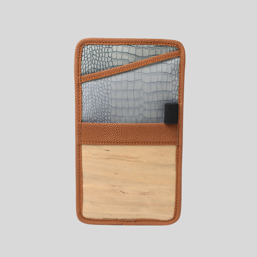 A brown vegan leather document holder that can be used for papers, passports, and many more, and has faux crocodile skin on the inside.