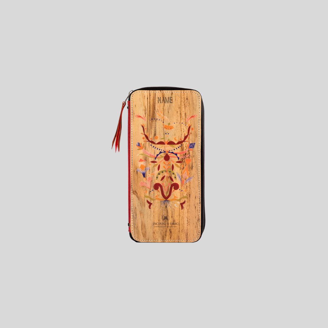A vegan leather zipped wallet with a symmetrical bold red and other colors design.