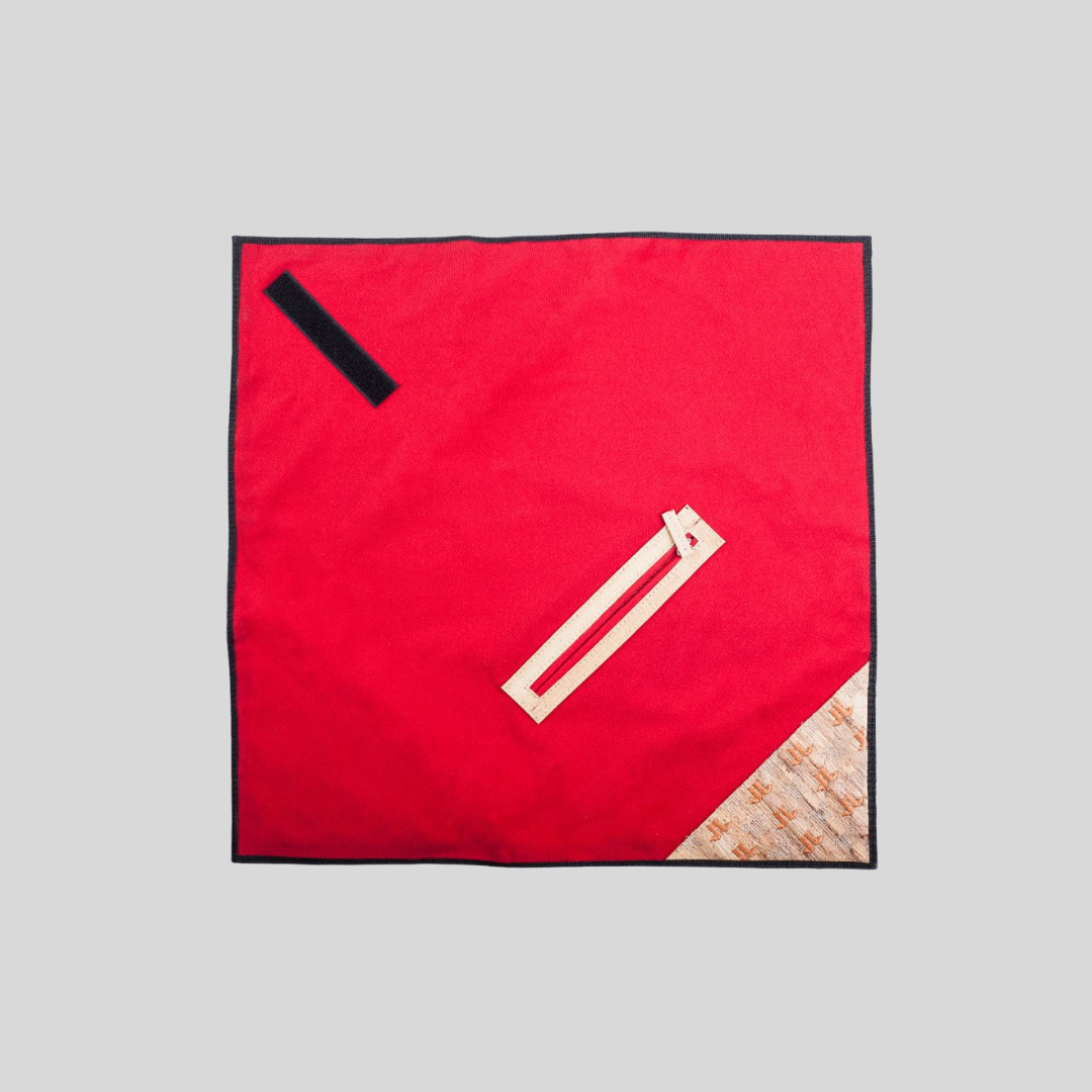 An un-wrapped wrap envelope clutch in bright red.