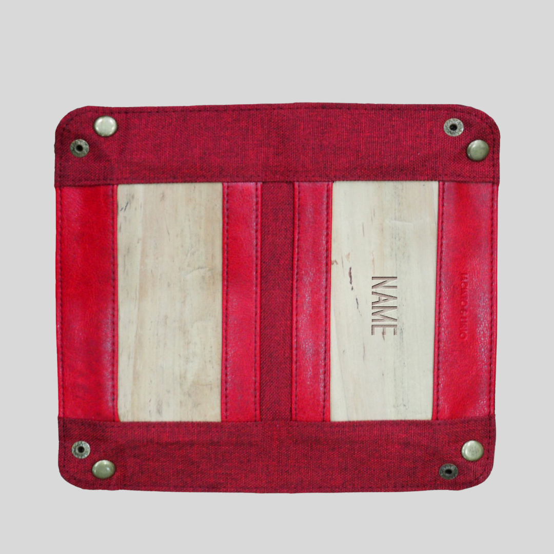 A red vegan leather square with metal clasps in the corners.