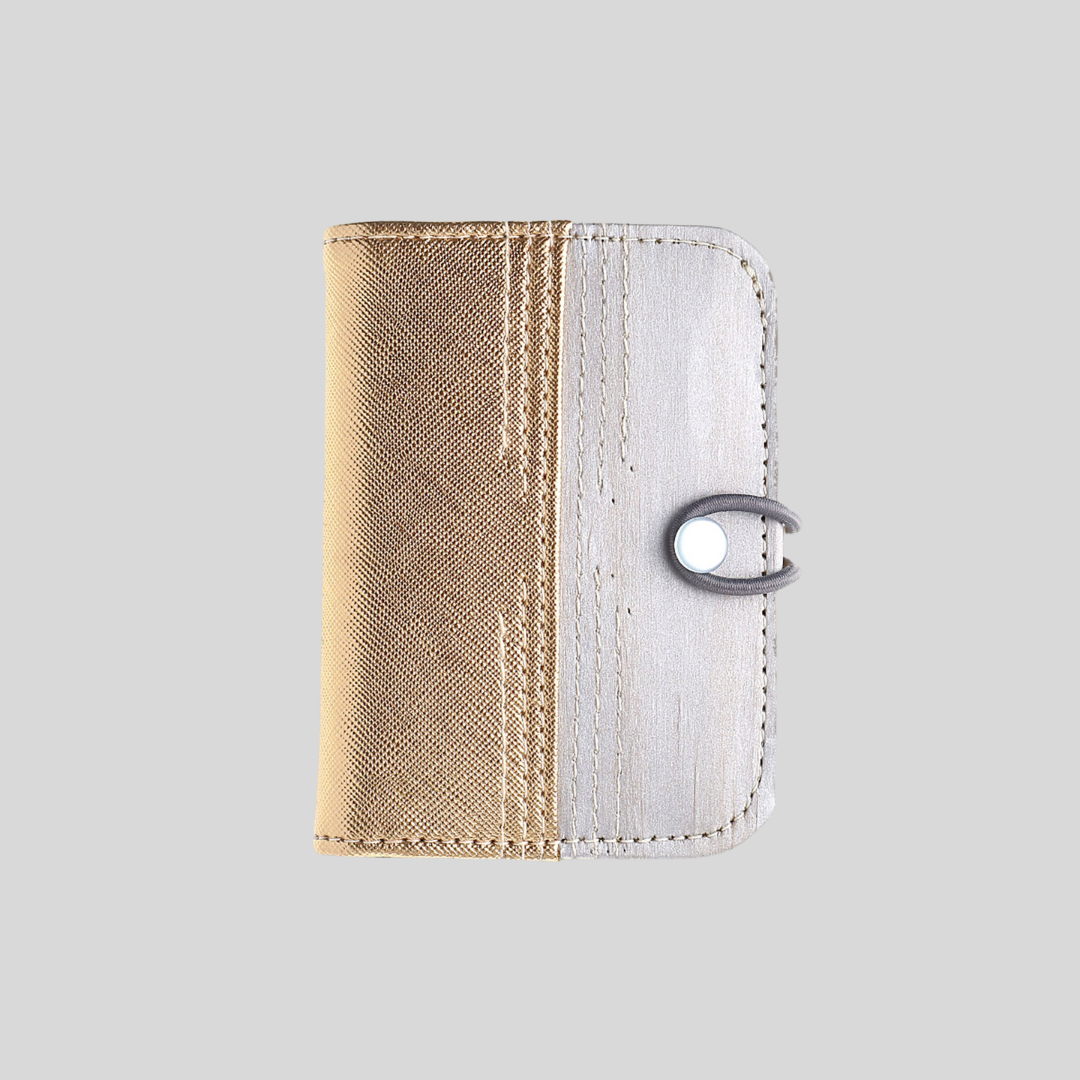 A gold and silver vegan leather card wallet.