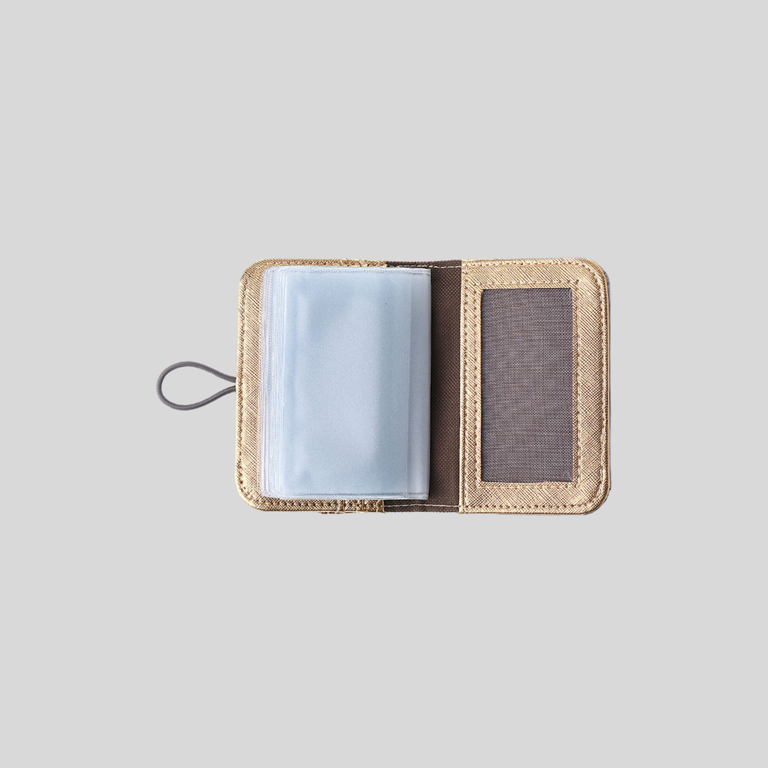 A card wallet is opened, showing its clear plastic inserts for the cards.