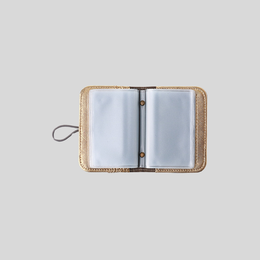 An opened card wallet that contains many clear plastic card pockets.