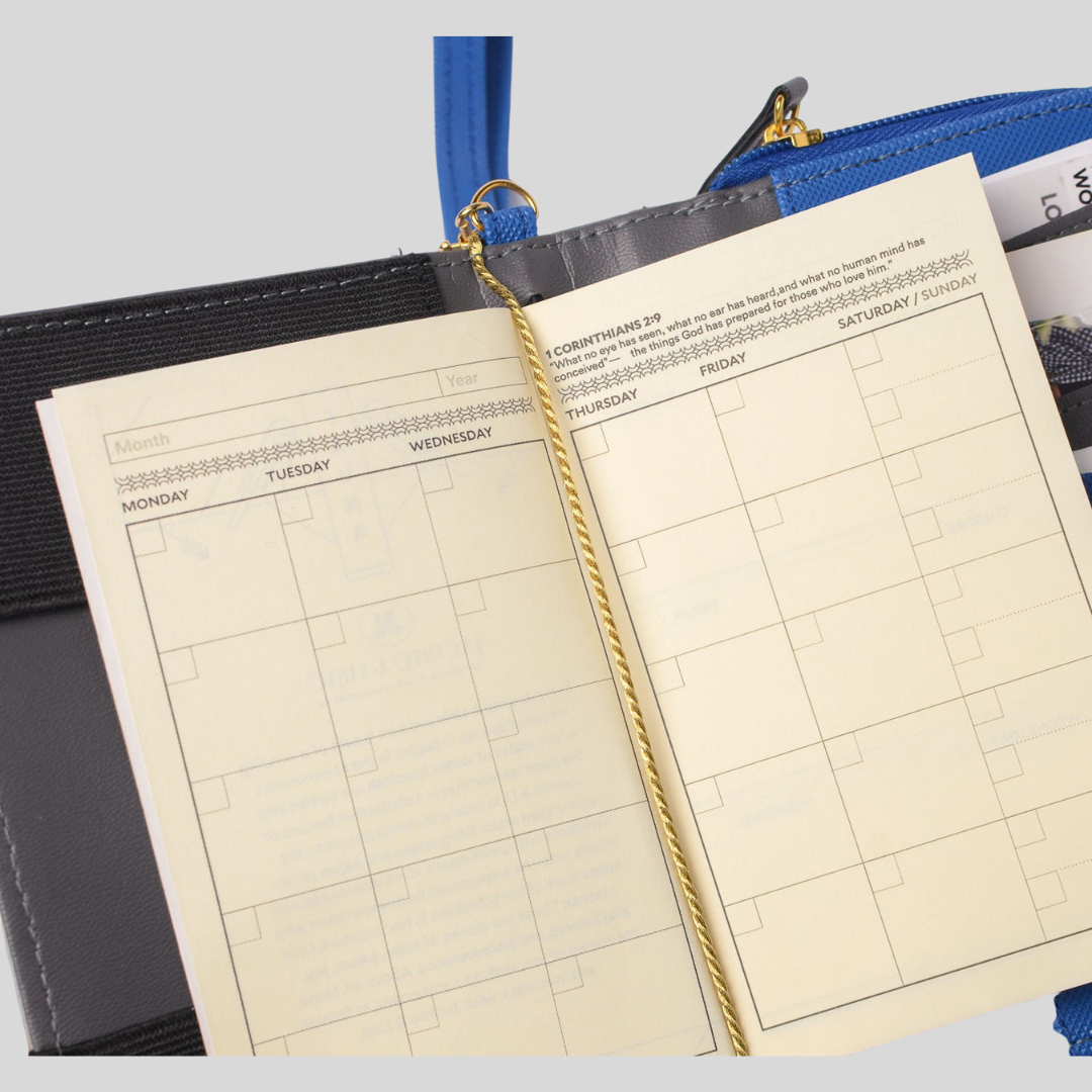 Dated pages of a vegan leather journal.