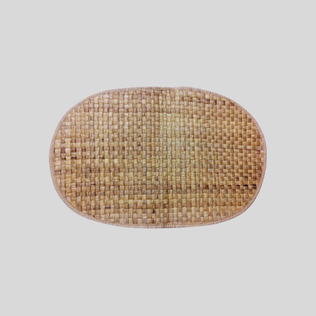A woven oval-shaped mat, made out of vegan leather strips.