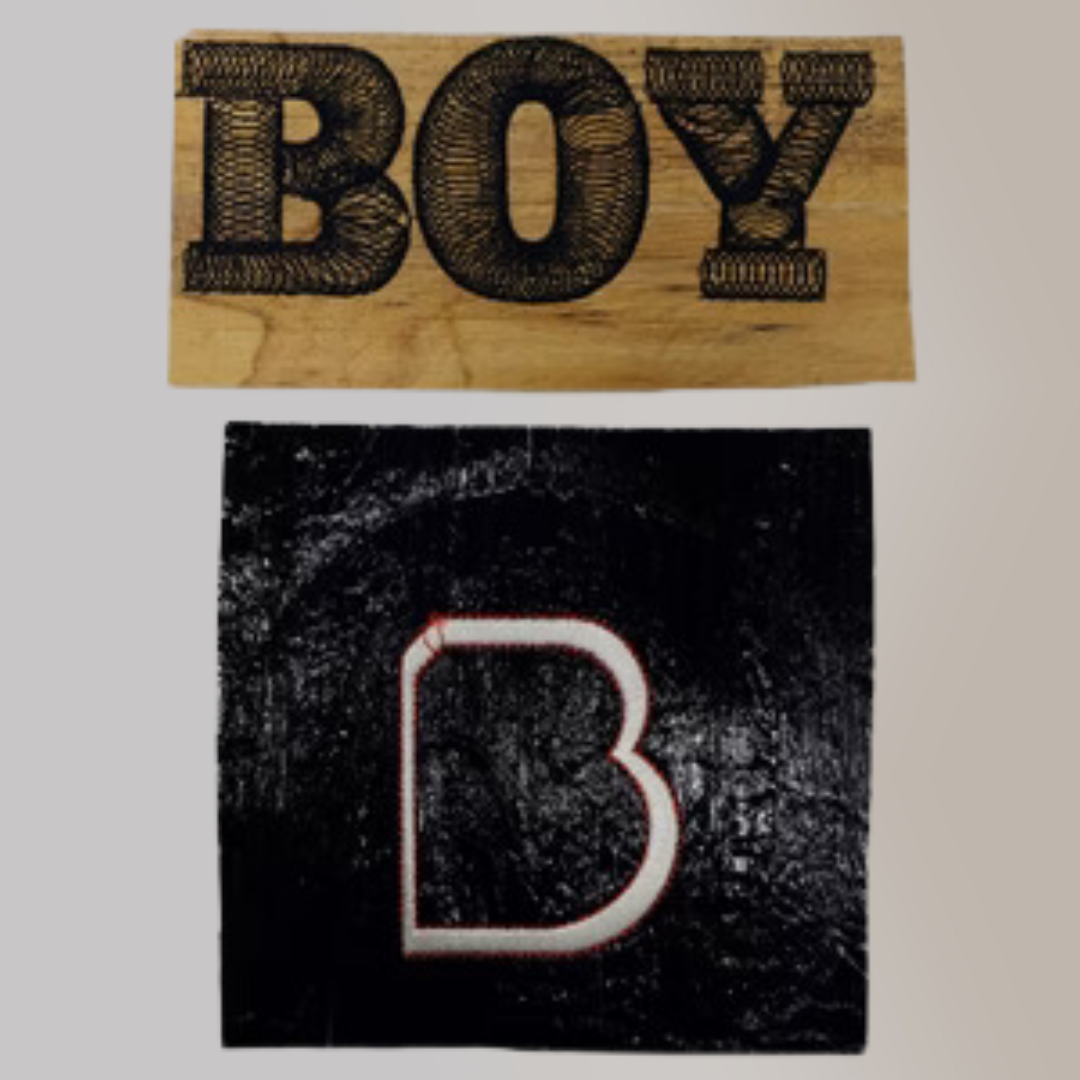 Artistically embroidered words on vegan leather.