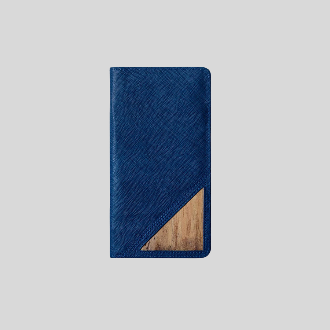 A blue vegan leather wallet with water hyacinth leather in the corner for an accent.