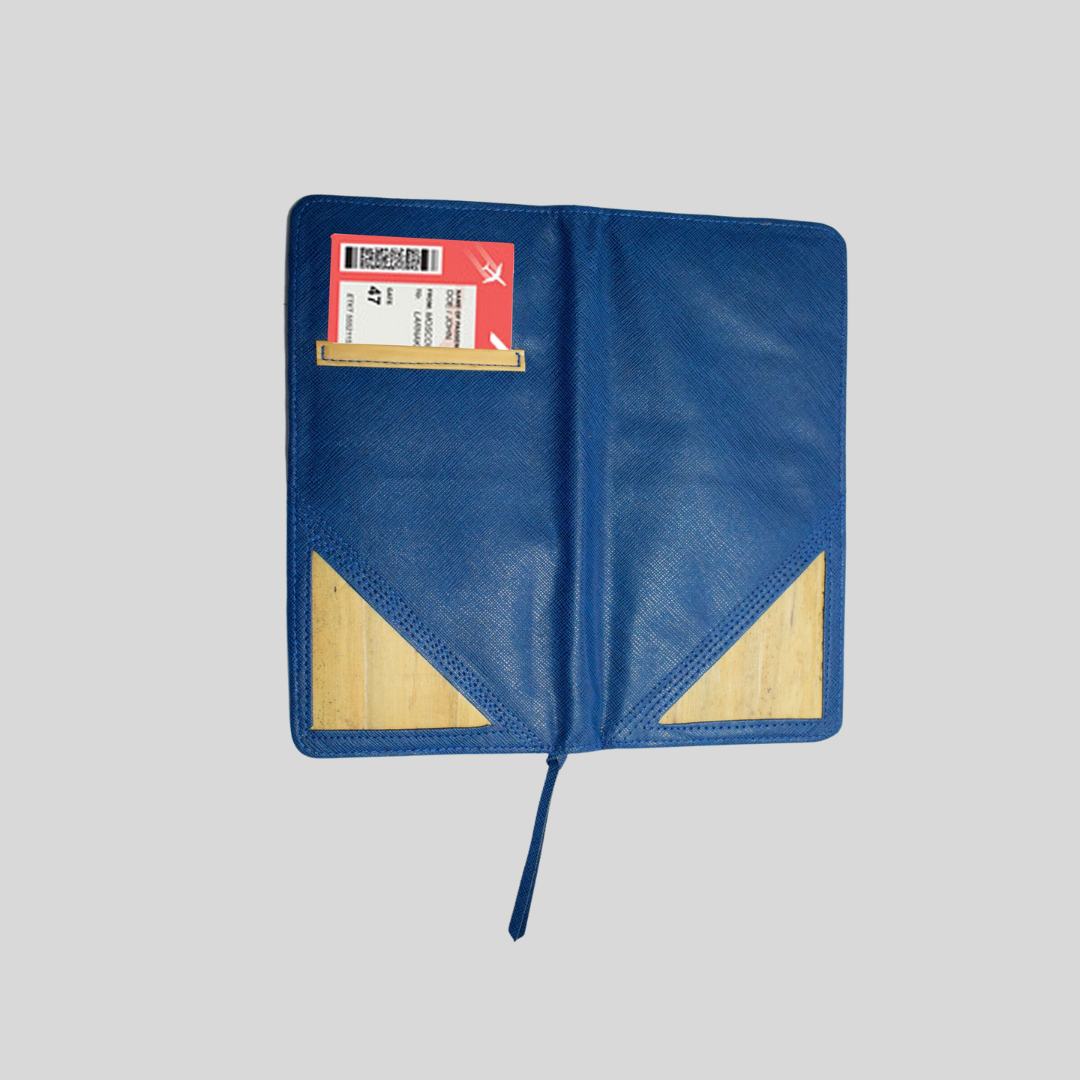 A blue vegan leather wallet holding a boarding ticket in its back pocket.