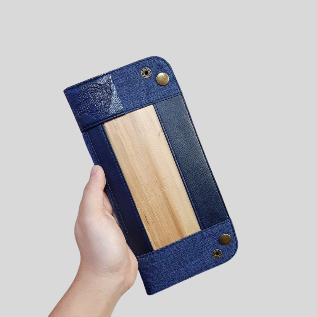 The back of a vegan leather wallet with a custom dry embossed logo on the corner.