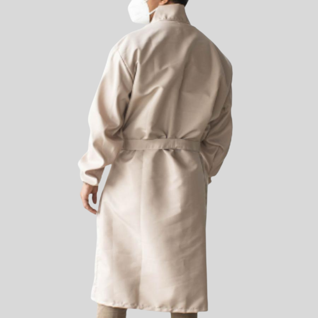 The back view of man wearing a peach waterproof PPE suit with a matching belt around his waist.