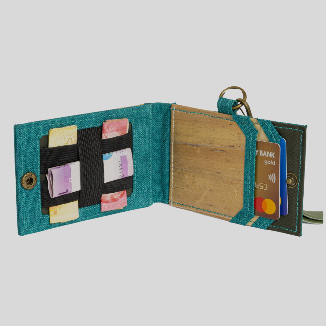 The inside of a multifunction ID lanyard that has compartments for cards and bills.