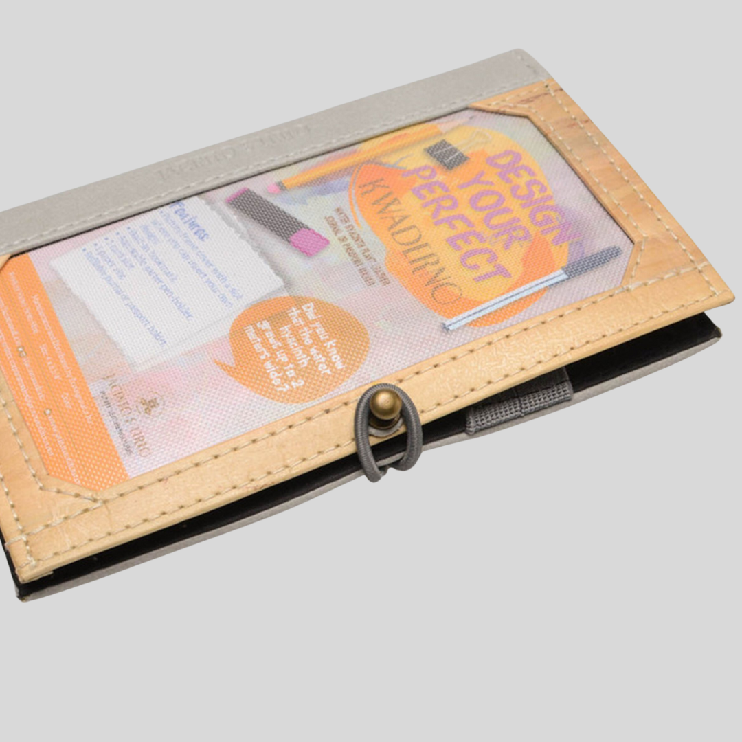 Notebook with gray fabric accents and water hyacinth-made vegan leather frame on the cover that can be customized.