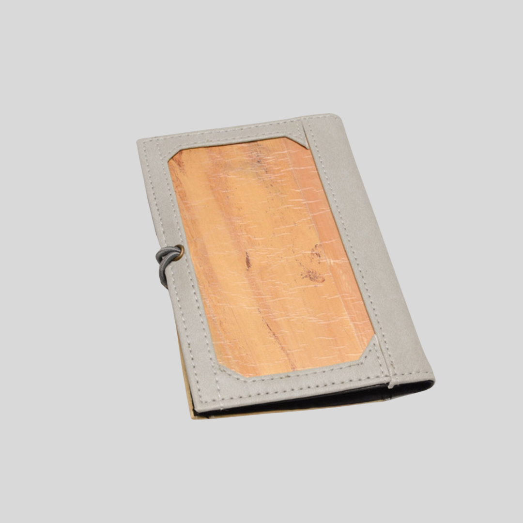 Backside of Vegan leather notebook, with vegan leather on the center framed by gray leather