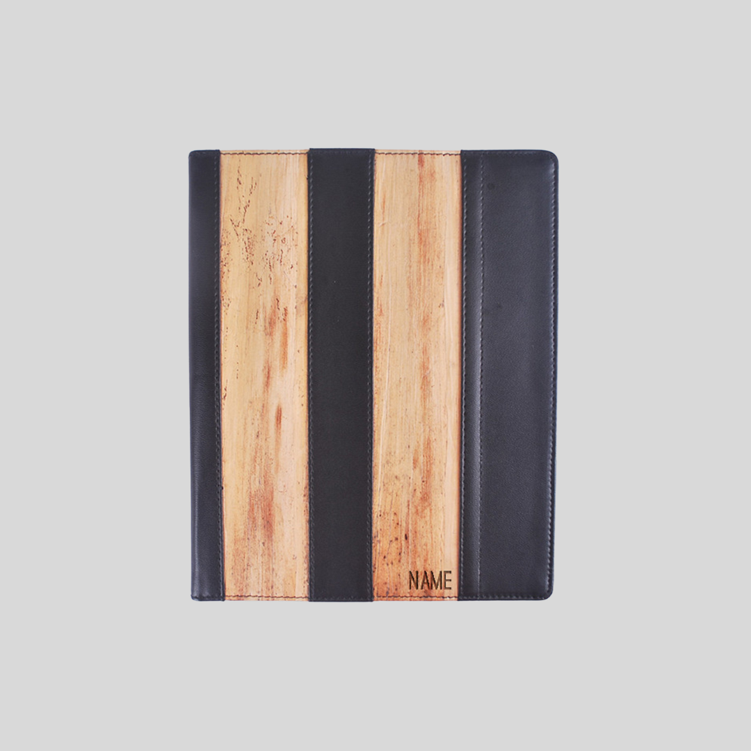 Top view of black leather ipad case with vegan leather accents and name personalization on the bottom.