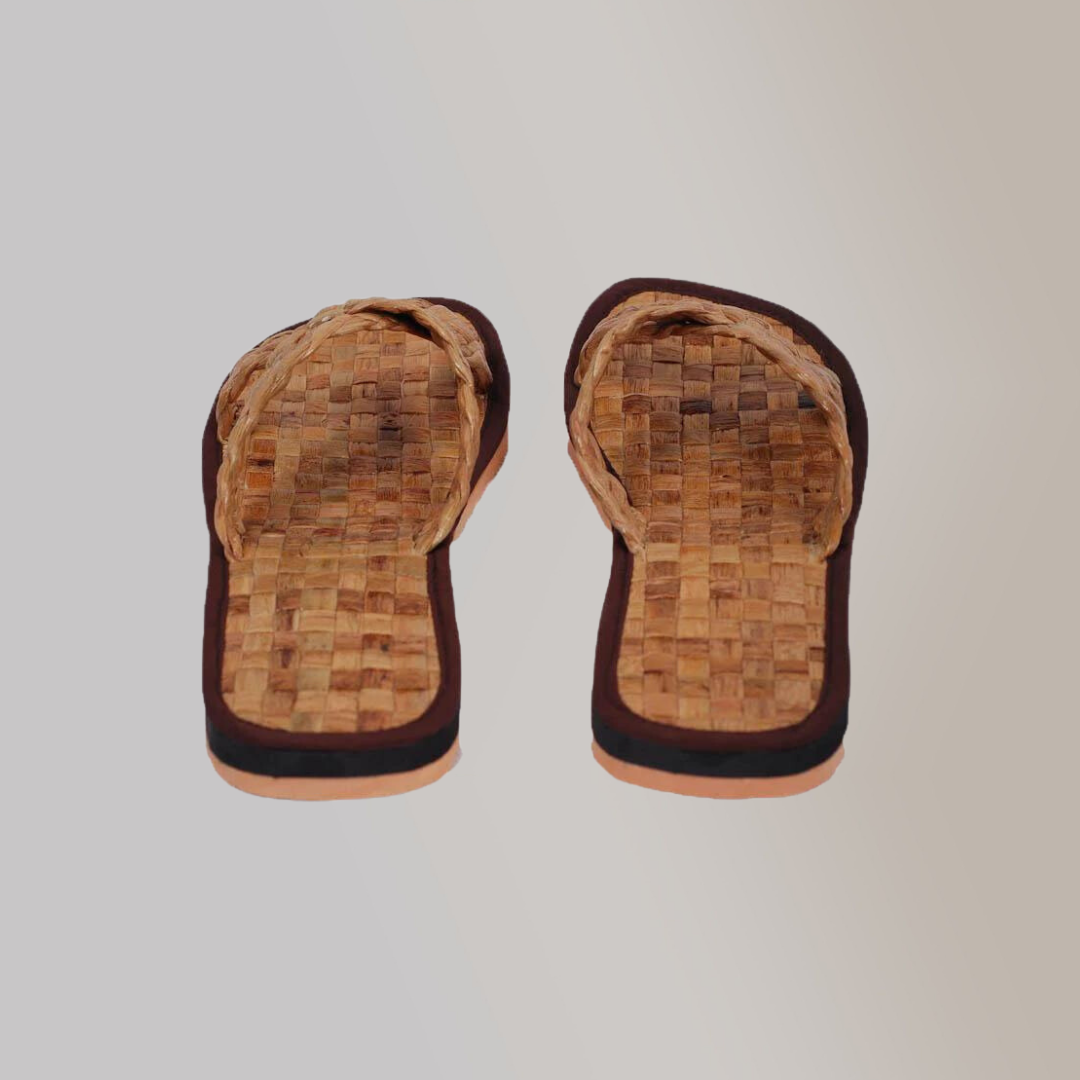 Textured and thick, woven vegan leather slippers in an earthy-tone.
