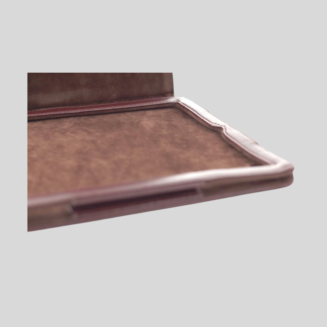 inside of a brown ipad case made out of vegan leather and brown suede fabric.