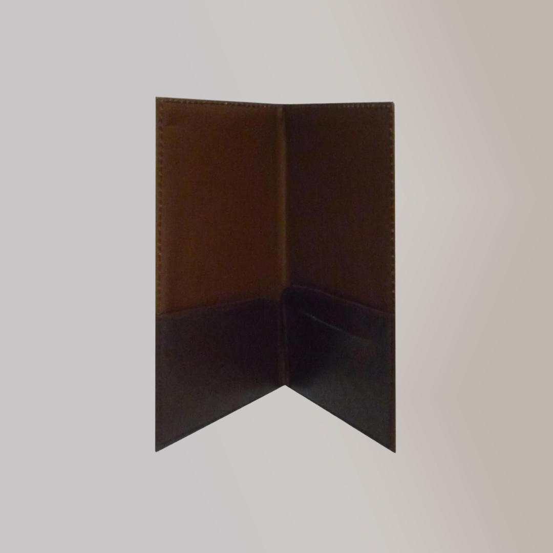 A brown leather hotel keycard holder standing upright and slightly opened