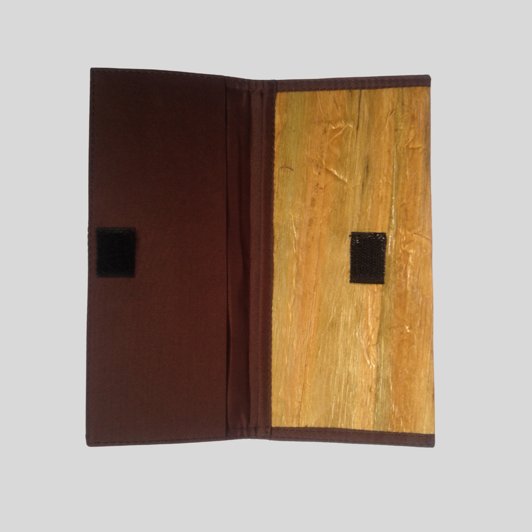 opened Vegan leather purse with a velcro closure, water hyacinth vegan leather exterior and brown fabric interior.