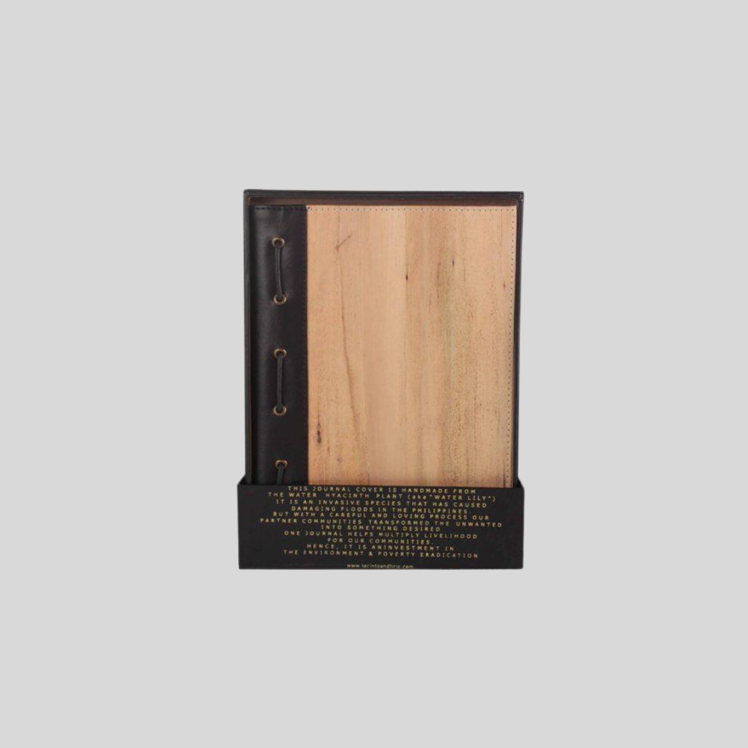 A vegan leather journal standing upright in a small black box