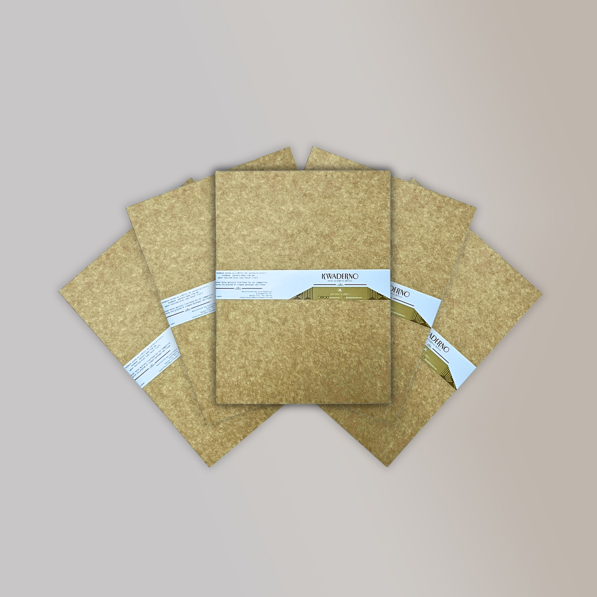top view of 5 pieces of Medium sized notebook refills from Jacinto & Lirio with a paper cardboard exterior and logo fanned out.