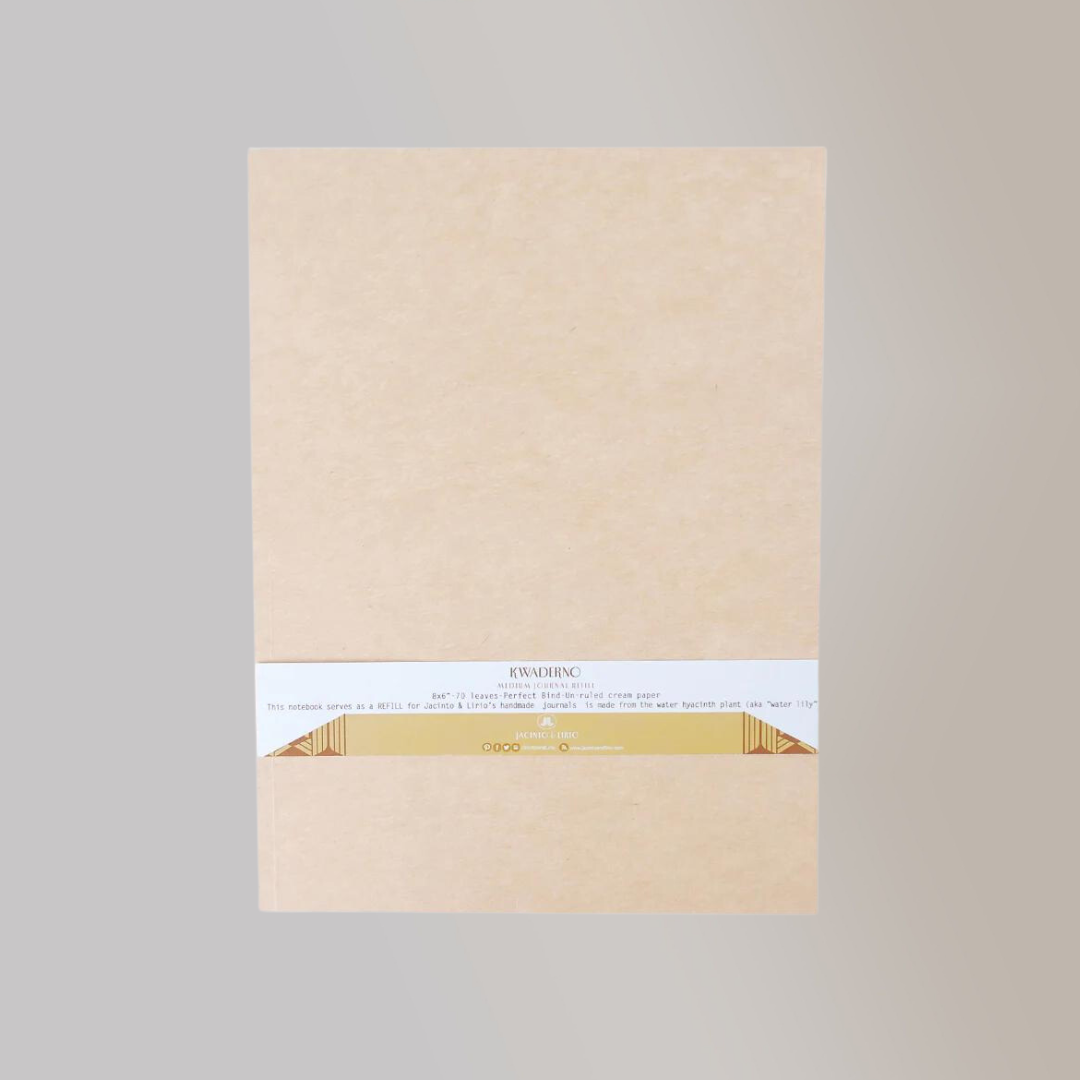 The back view of a pale, cream colored notebook with a product tag hugging the bottom.