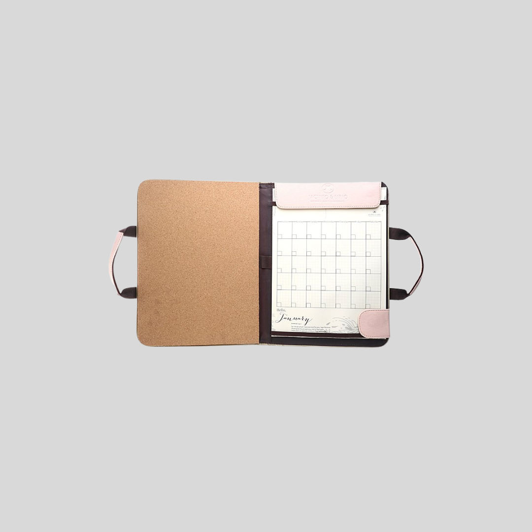 A pink planner that has a corkboard inner flap.