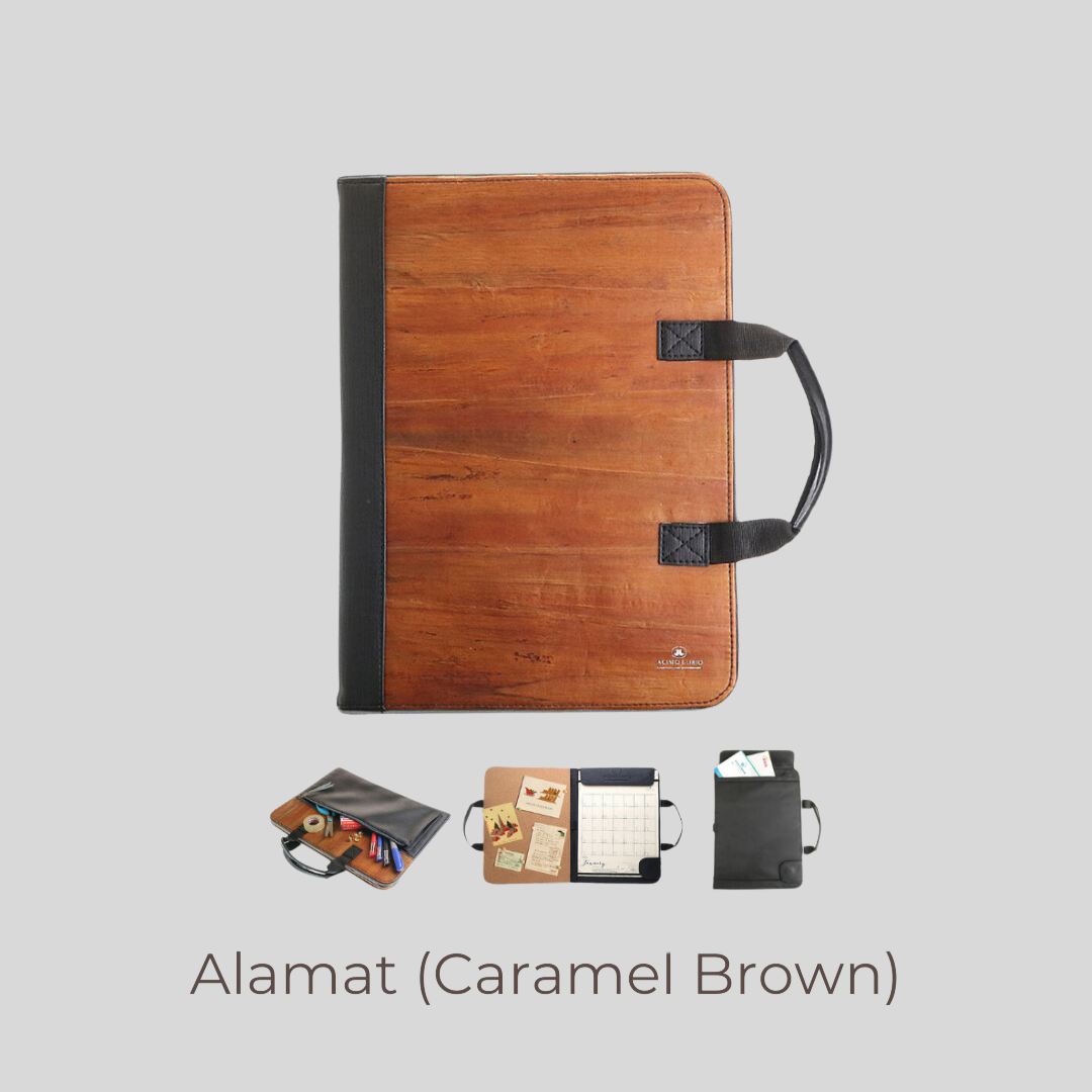 A laptop-sized vegan leather planner in a caramel brown color.