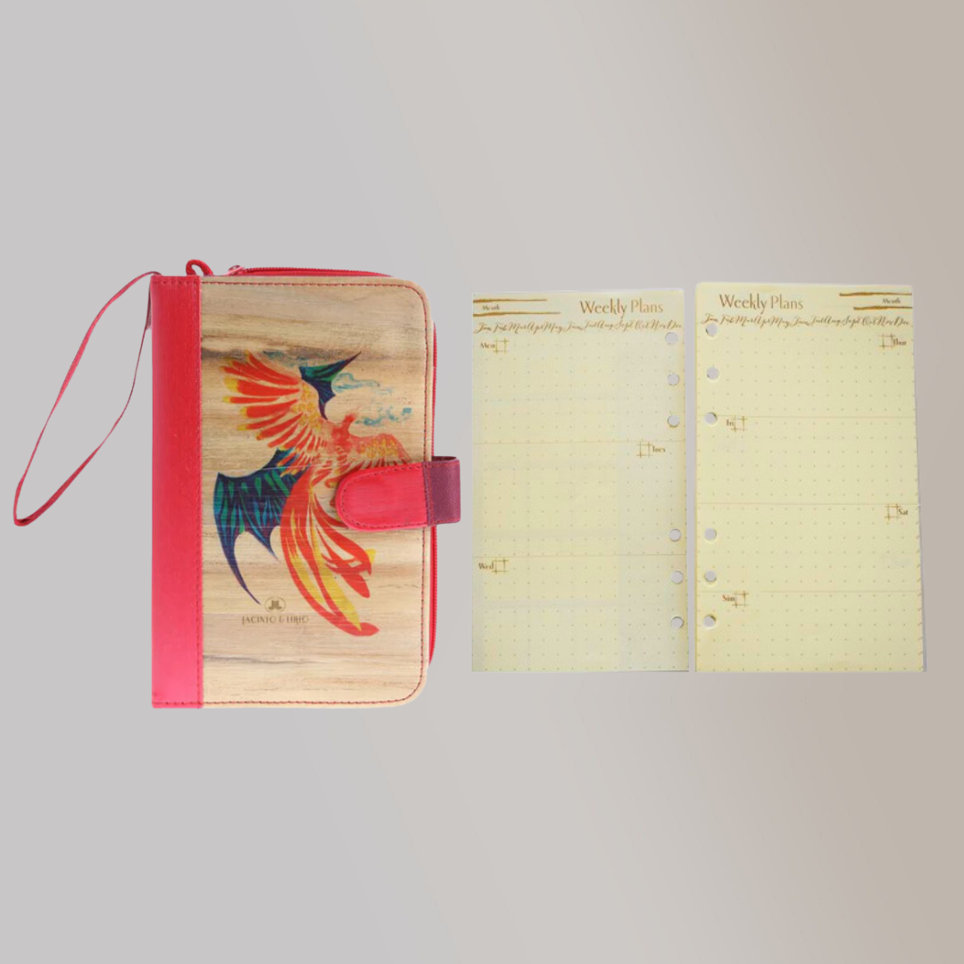 An A6 vegan leather notebook with a vibrant Phoenix design laid next to its refillable pages in cream color.