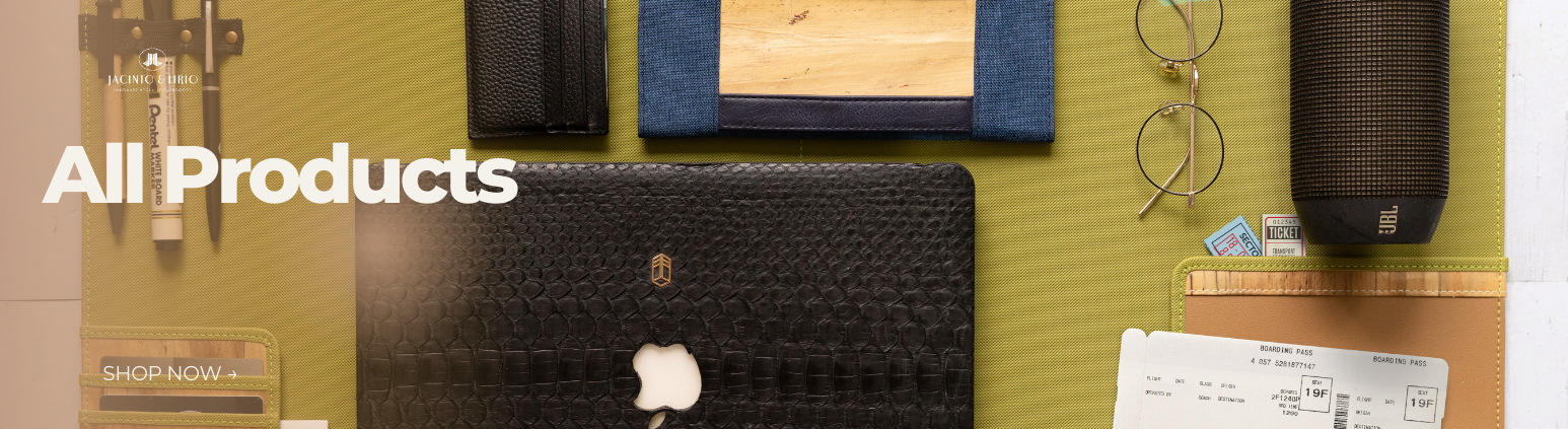 A bunch of vegan leather products laid out on a green surface.