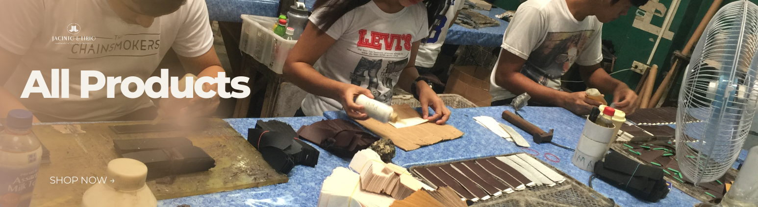 A line of workers assembling vegan leather products in a factory.