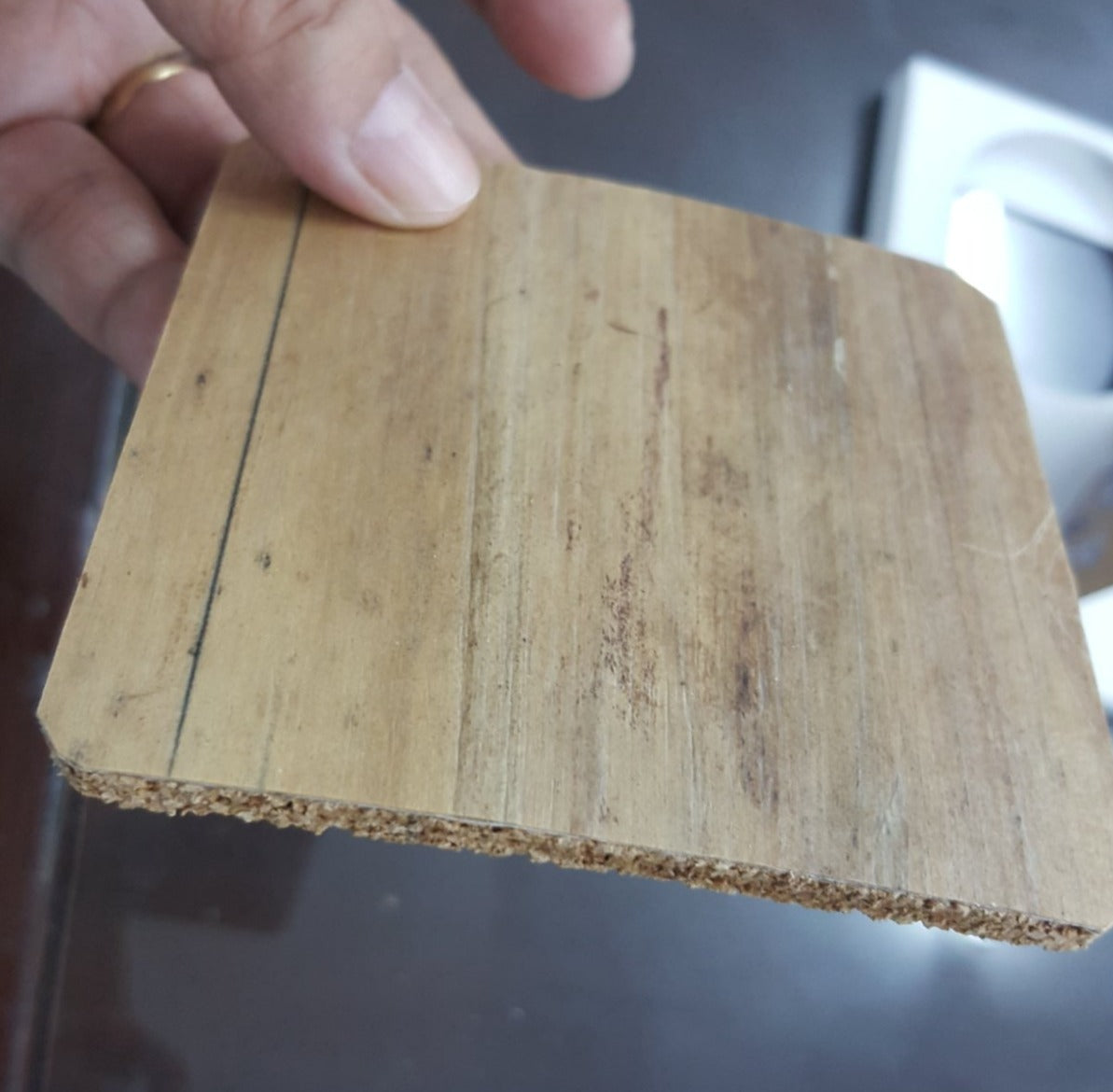 back of square coaster, completely flat and showing water hyacinth vegan leather.