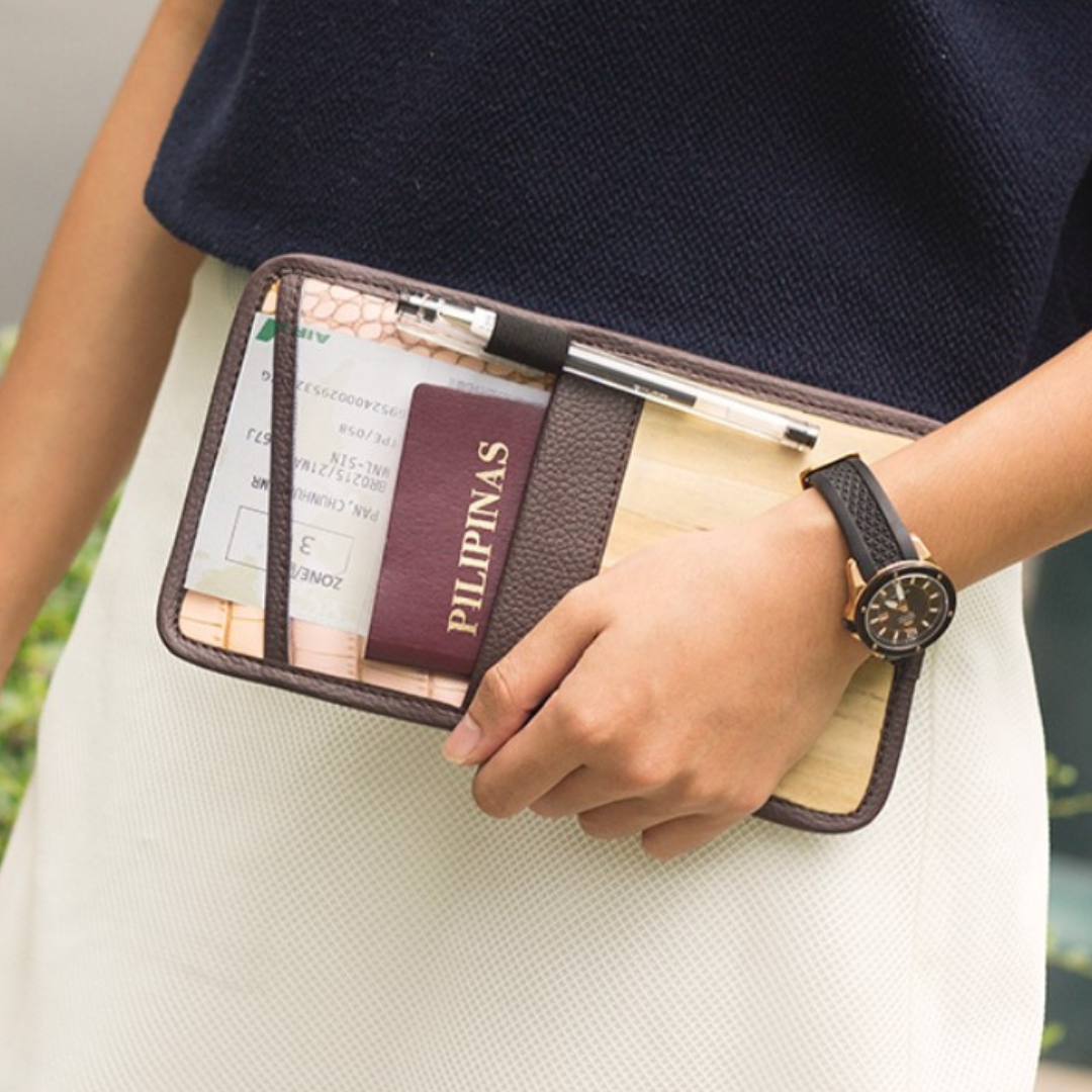 Lakbay wallet pouch has elastic pen holder and outer pockets for easy writing of essential information.