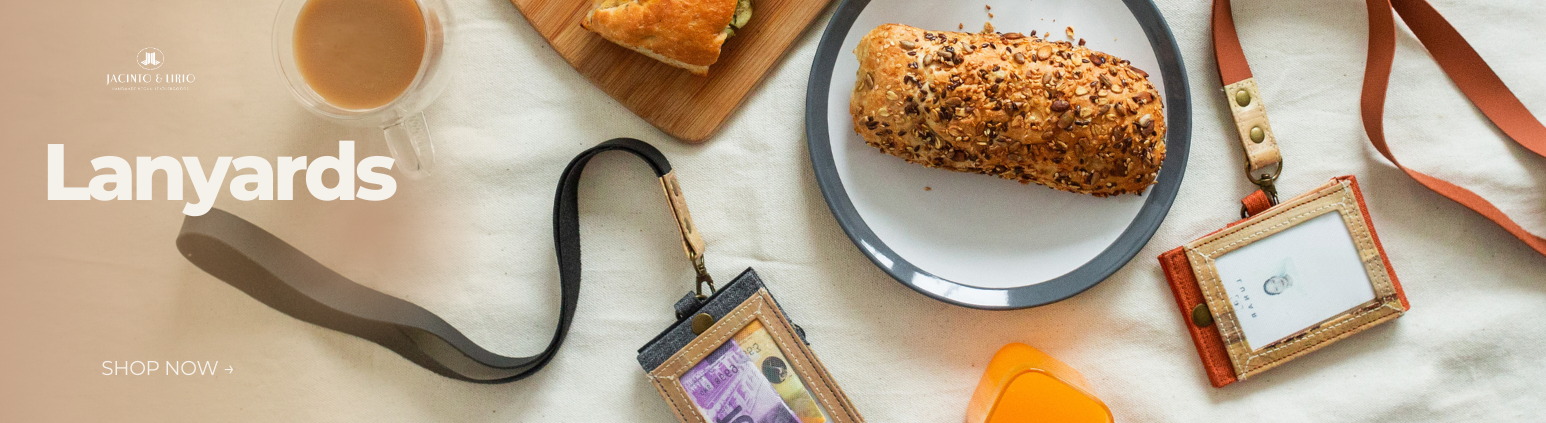A piece of bread on a plate next to vegan leather ID lanyards.